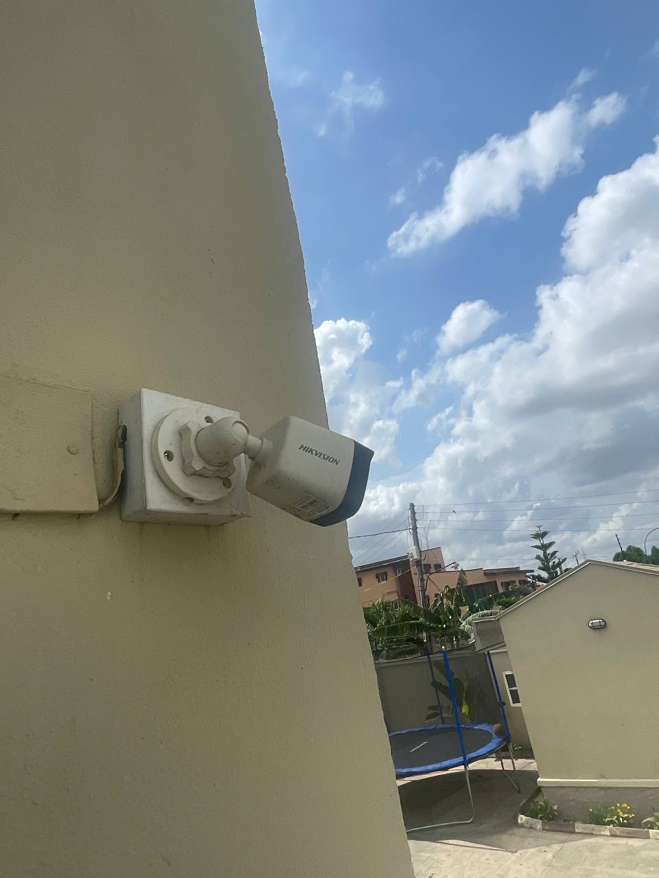 Externally mounted CCTV camera against an open sky